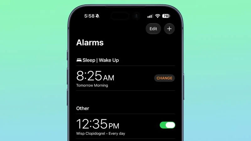Ứng dụng Đồng hồ trên iOS 27.2 Beta 1 thu nhỏ ký hiệu a.m. và p.m. khi hiển thị báo thức.