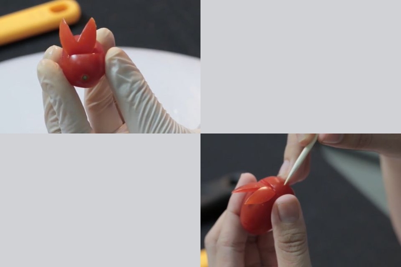 Dùng tăm nhọn đục một lỗ nhỏ để đặt hạt vừng đen vào làm mắt