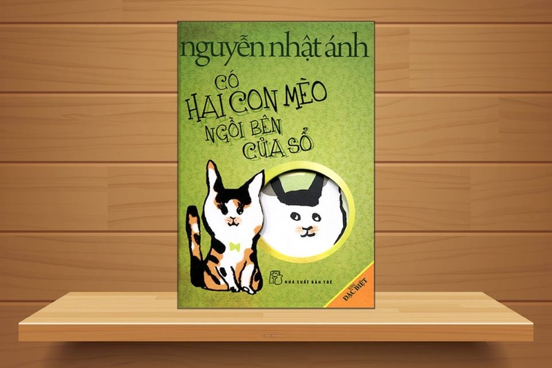 Có hai con mèo ngồi bên cửa sổ