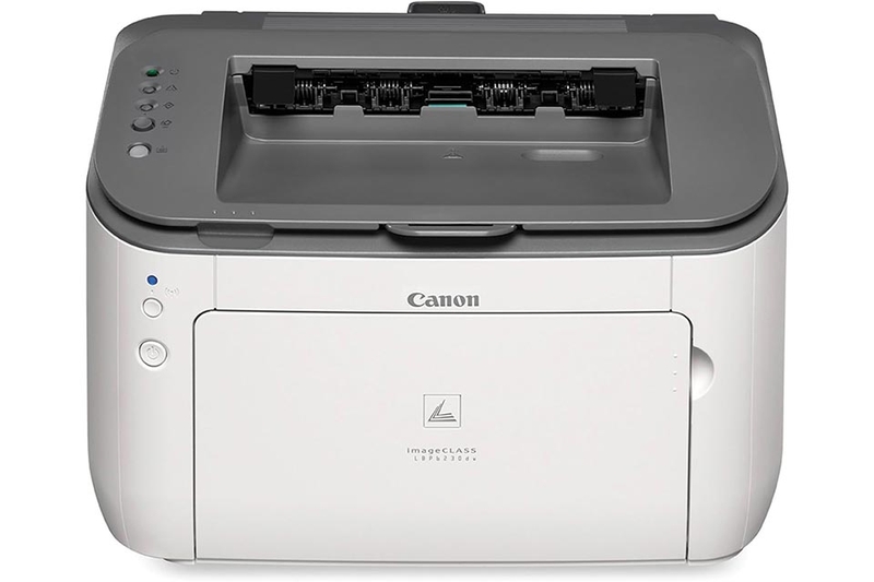 Hình ảnh máy in Canon LBP 6230 nhỏ gọn đặt trên bàn làm việc