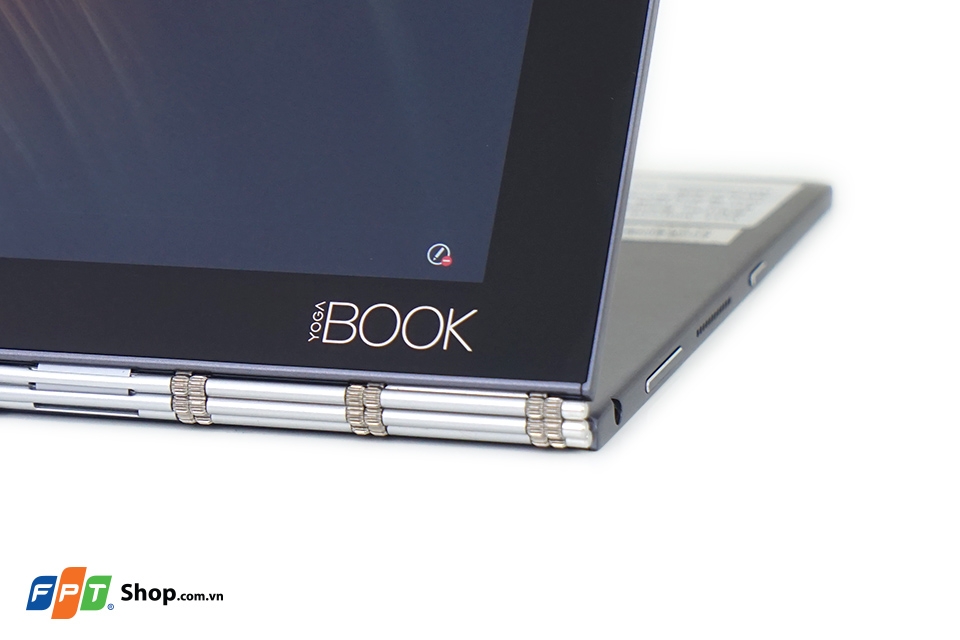 Hai phần của Yoga book được kết nối bằng hệ thống bản lề kiểu dây đồng hồ