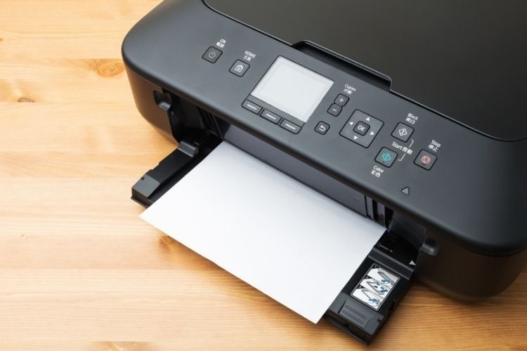 Máy in bị nhòe mực do giấy in