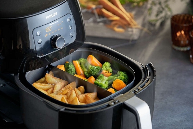 Nồi chiên không dầu đang nấu có mở ra được không ảnh 1