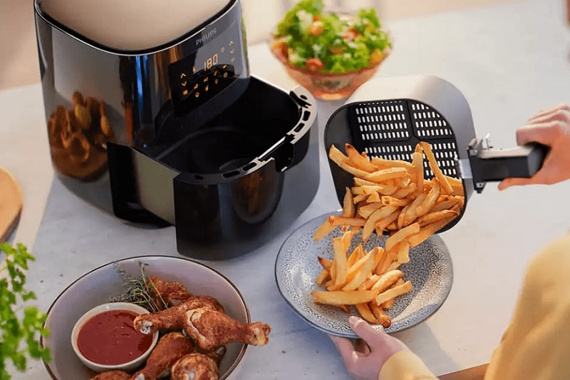 Nồi chiên không dầu đang nấu có mở ra được không ảnh 2