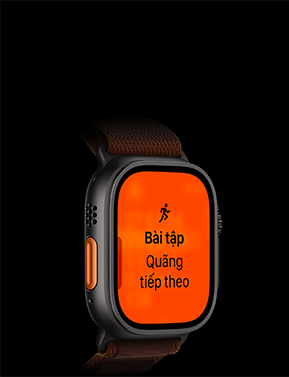 Apple Watch Ultra 4, vỏ titan, màu đen, bài tập Chạy Bộ, quãng tiếp theo, mặt ngoài bên trái, nút Tác Vụ màu cam, Dây Quấn Alpine