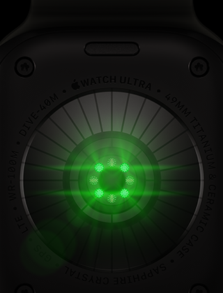 Mặt sau của Apple Watch Ultra 4, vỏ titan, màu đen, nhiều cảm biến hình tròn với đèn LED màu xanh lá phát sáng